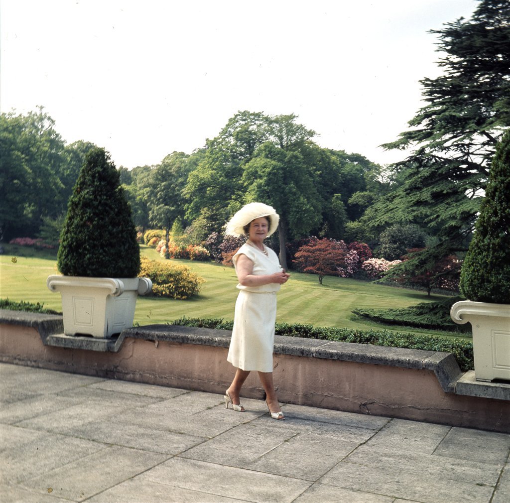 Detail of Queen Elizabeth, The Queen Mother in the gardens at Windsor Great Park by Cecil Beaton