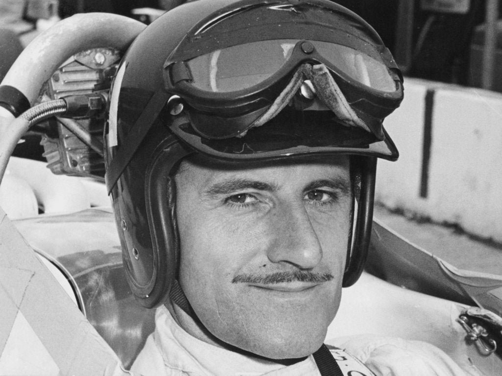 Detail of Graham Hill in cockpit of Lola T90, Indianapolis, 1966 by Unknown