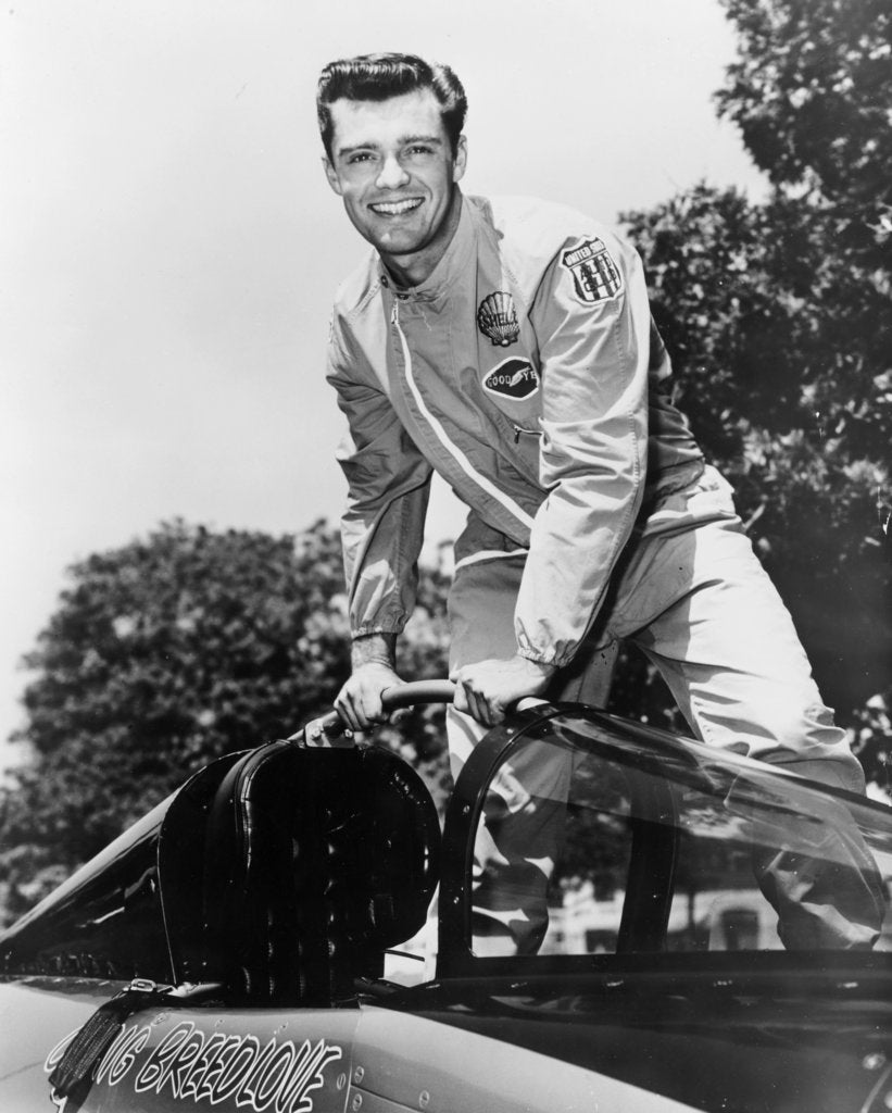 Detail of Craig Breedlove posing on top of the Spirit of America by Unknown