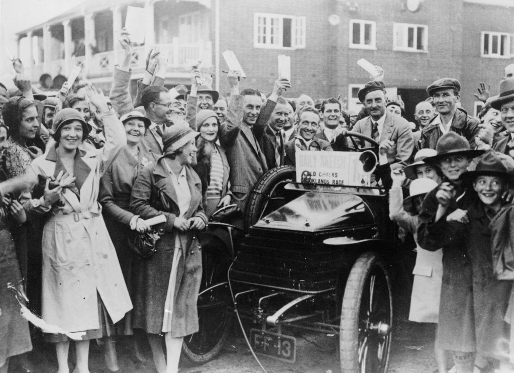 Detail of A 1904 Wolseley amidst a crowd of cheering people, Brooklands, Surrey, late 1920s-early 1930s by Unknown