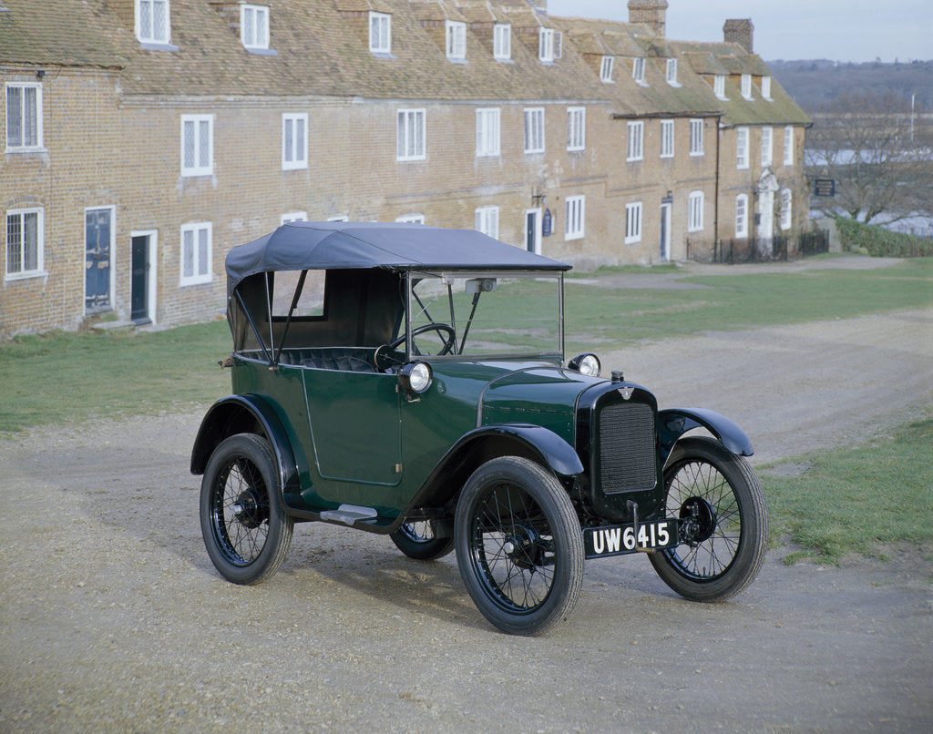 Detail of A 1929 Austin 7 in front of a row of terraced houses by Unknown