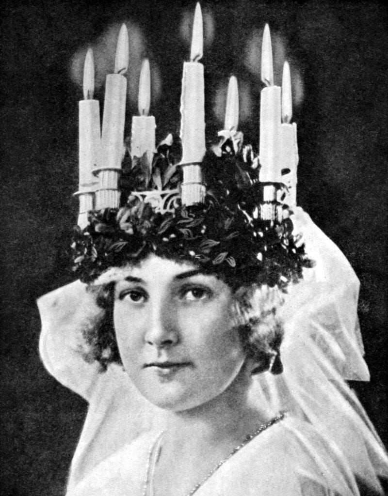 Detail of Scandinavian girl wearing candle headdress on St Lucy's Day by Fox