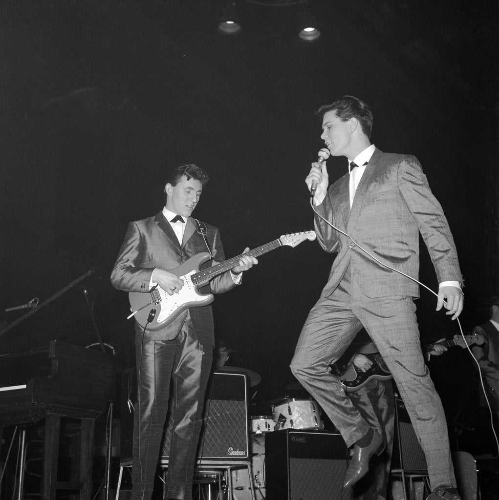 Detail of Cliff Richard singing on stage by Harry Hammond