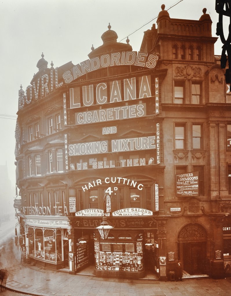 Detail of Illuminated advertisements on shop fronts at 7, Oxford Street, London, 1909 by Unknown