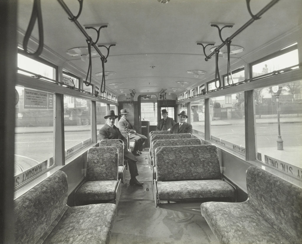 Detail of Men in hats and coats in the interior of an electric tram, London, 1933 by Unknown