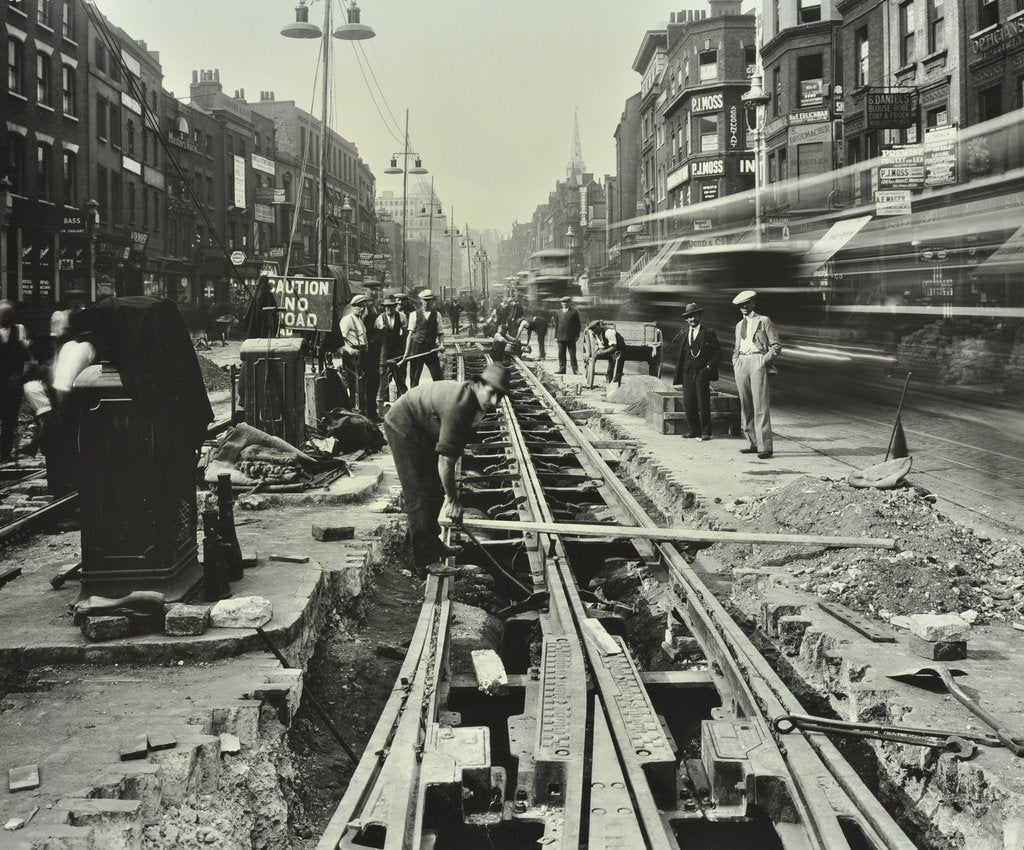 Detail of Men laying tramlines in the middle of the road, Whitechapel High Street, London, 1929 by Unknown