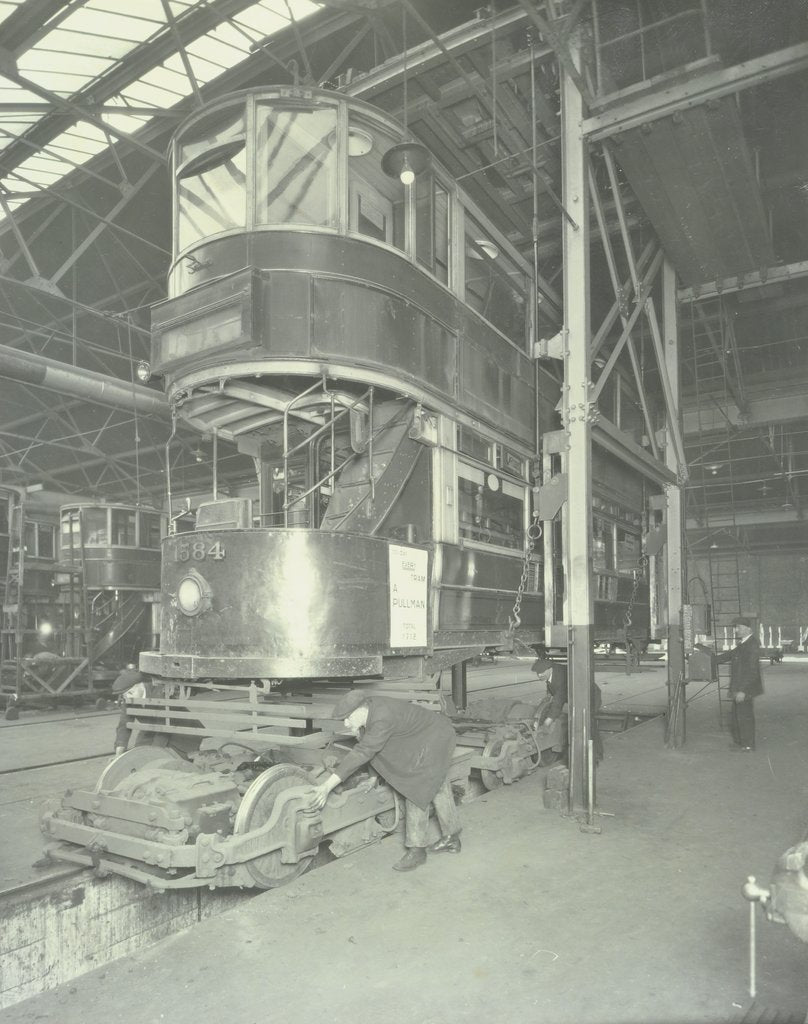 Detail of Men using a car lifting hoist at Charlton Central Repair Depot, London, 1932 by Unknown