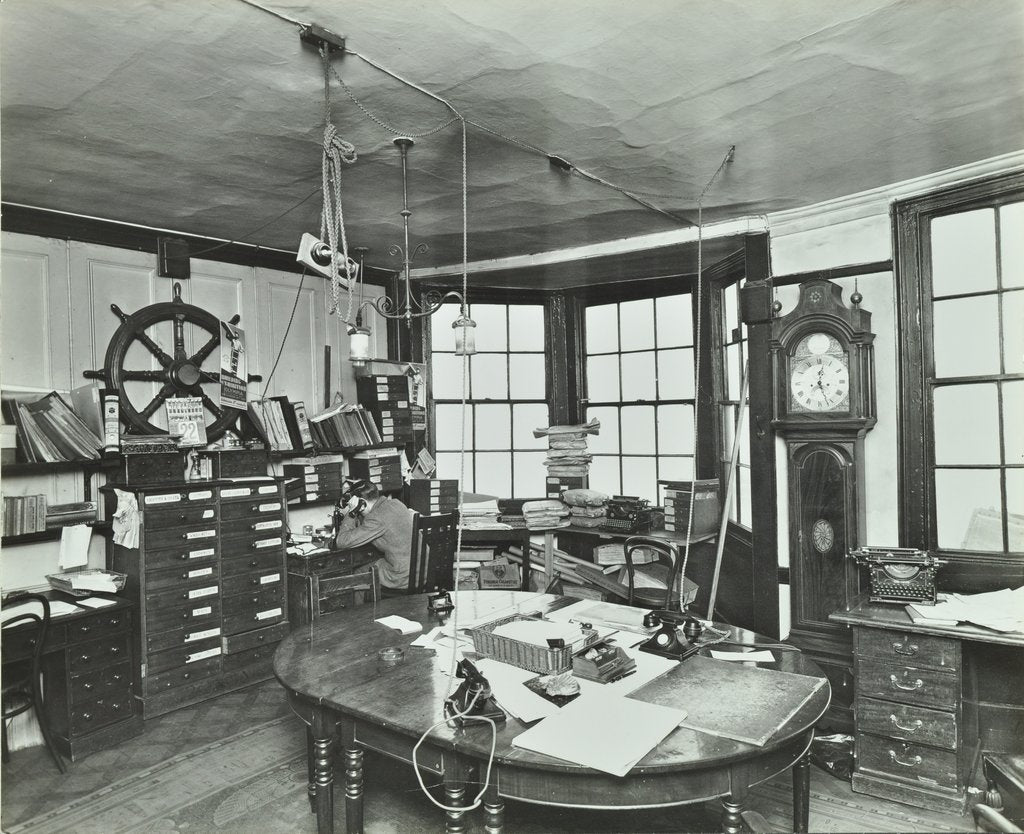 Detail of Interior of an office with a man on the telephone, Greenwich, London, November 1936 by Unknown