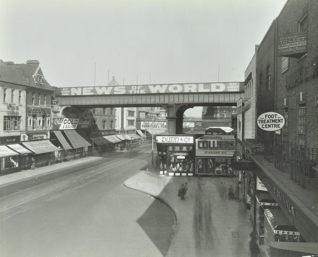 Detail of Railway bridge and advertising over the Brixton Road, Lambeth, London, 1938 by Unknown