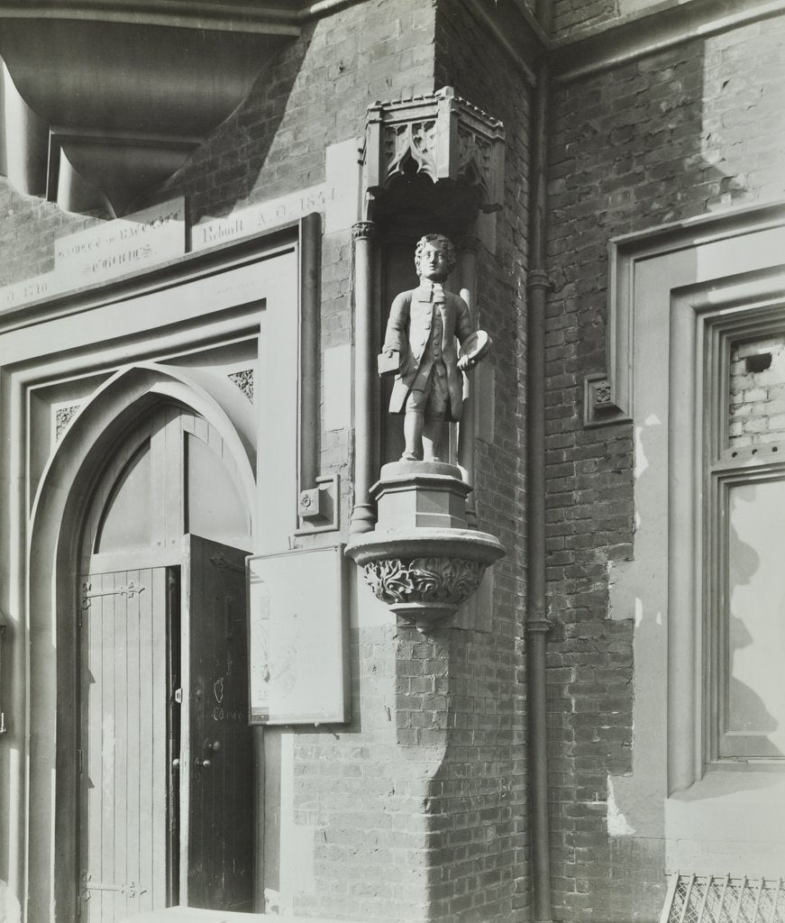 Detail of Statue of a boy scholar beside the door, Hamlet of Ratcliff Schools, Stepney, London, 1945 by Unknown