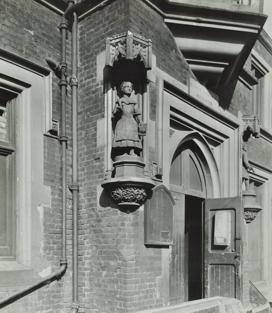 Detail of Statue of a girl scholar beside the door, Hamlet of Ratcliff Schools, Stepney, London, 1945 by Unknown