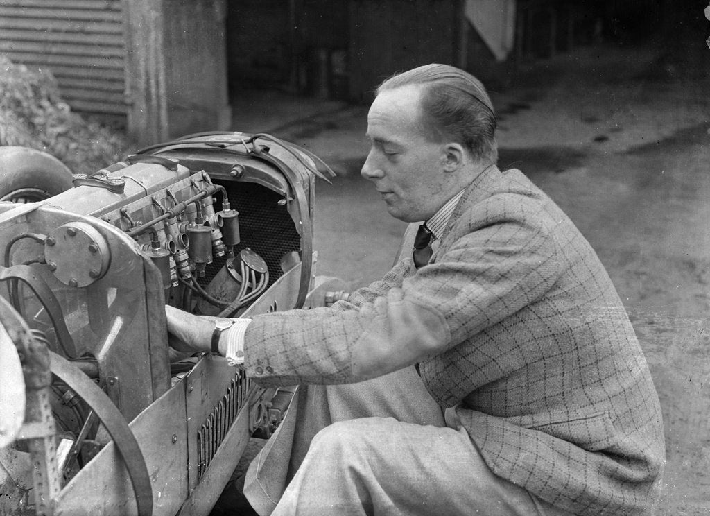 Detail of Charles Mortimer working on the engine of a MG KN Special, c1930s by Bill Brunell