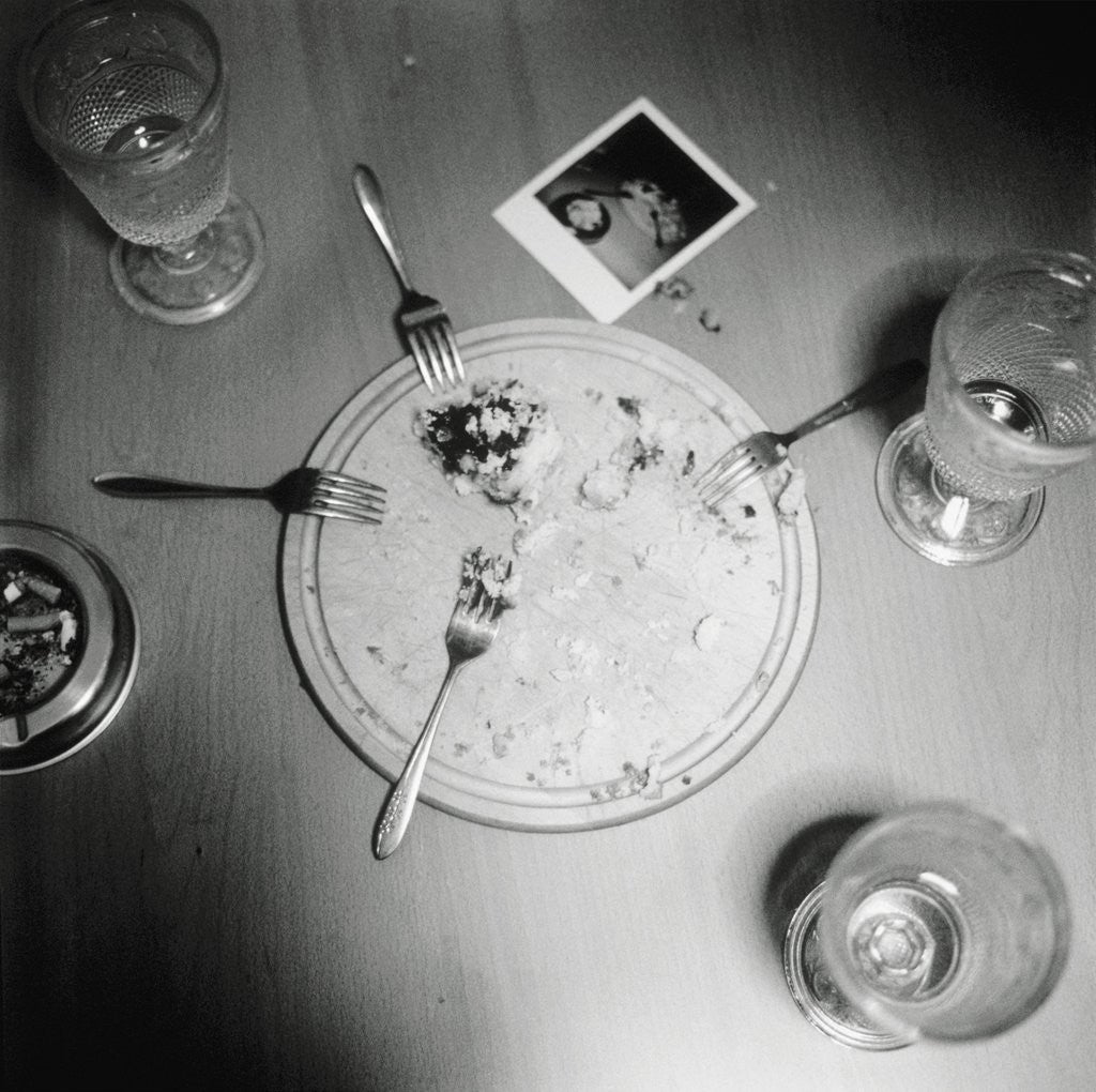 Detail of Plate with forks and glasses on a table by Corbis