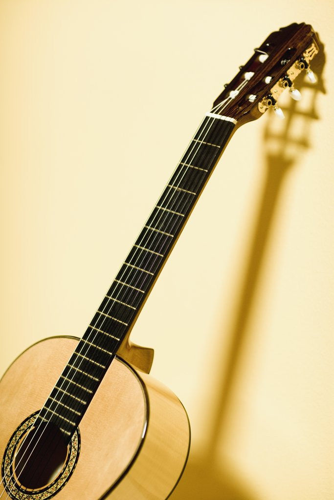 Detail of Guitar Leaning Against Wall by Corbis