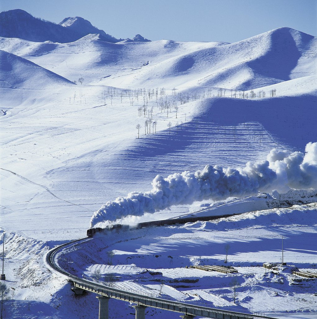 Detail of Steam Locomotive Crossing Snowy Mountains by Corbis