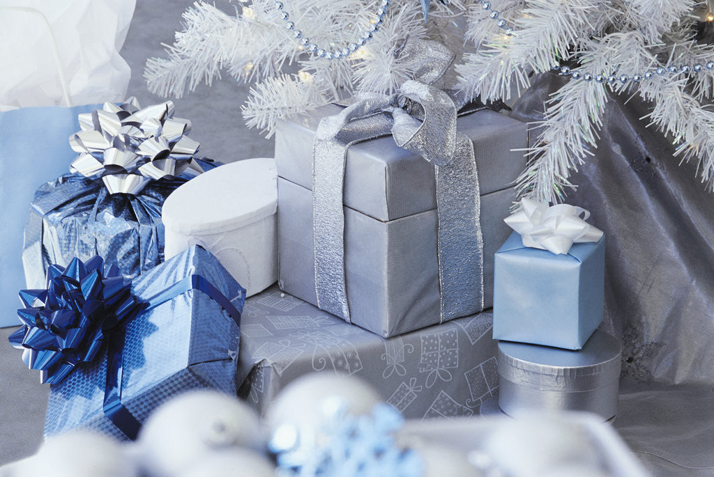 Detail of Silver and blue wrapped gifts by Corbis