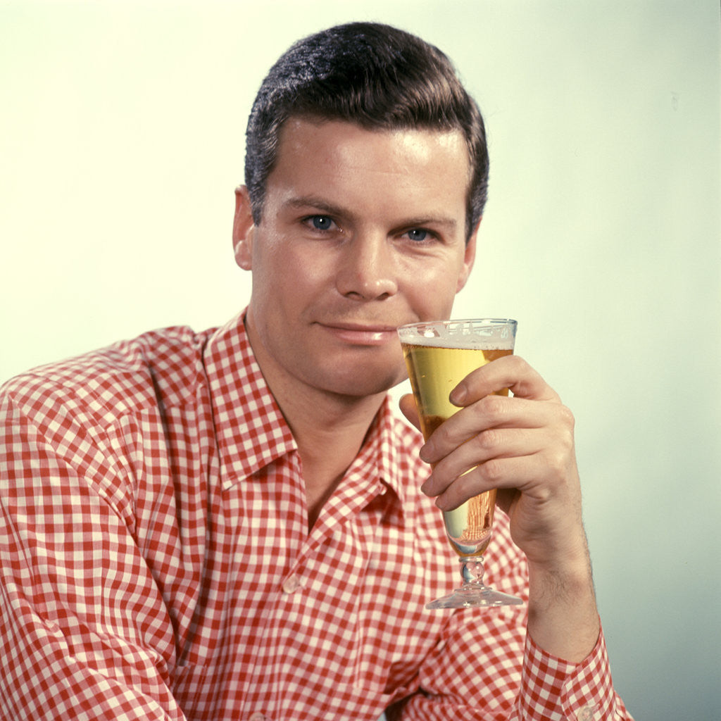 Detail of 1960s Man Red Checked Shirt Drinking Beer From Pilsner Glass by Corbis