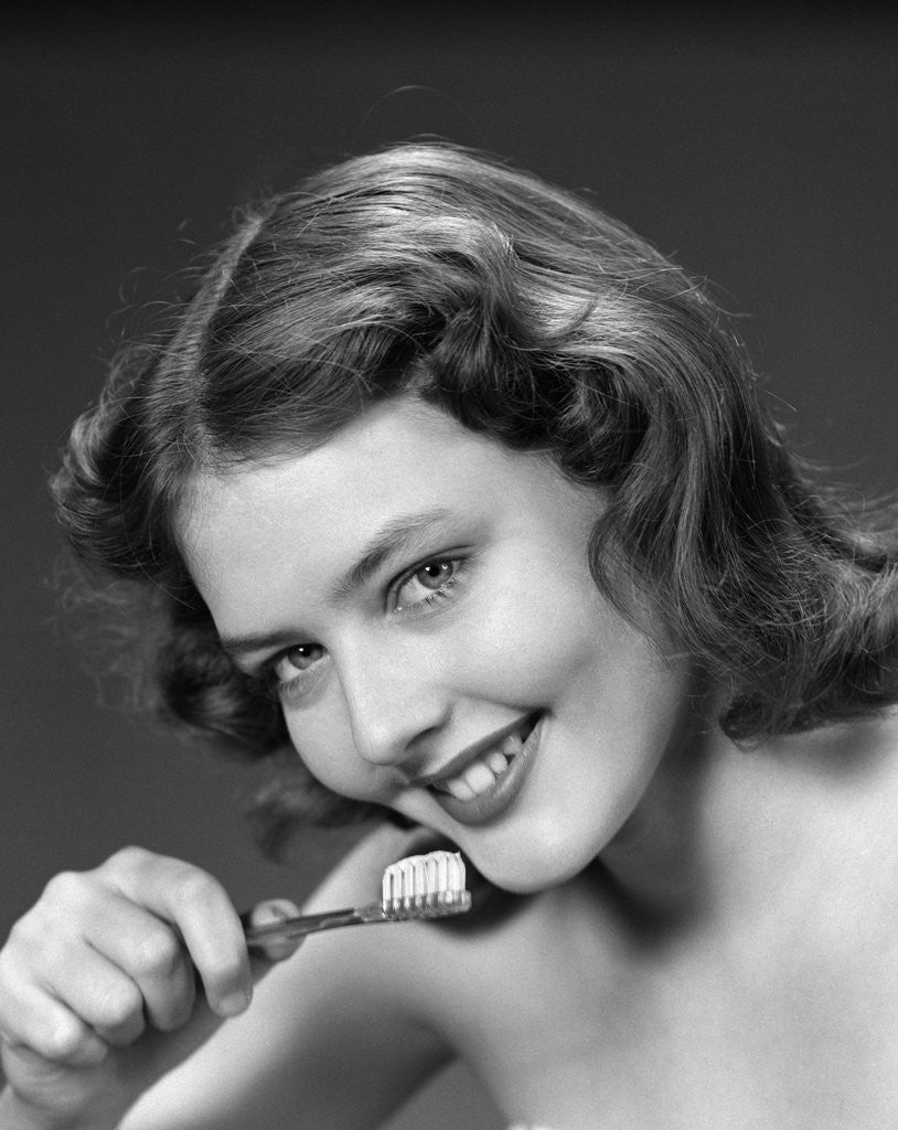 Detail of 1940s 1950s Woman Holding Tooth Brush by Corbis