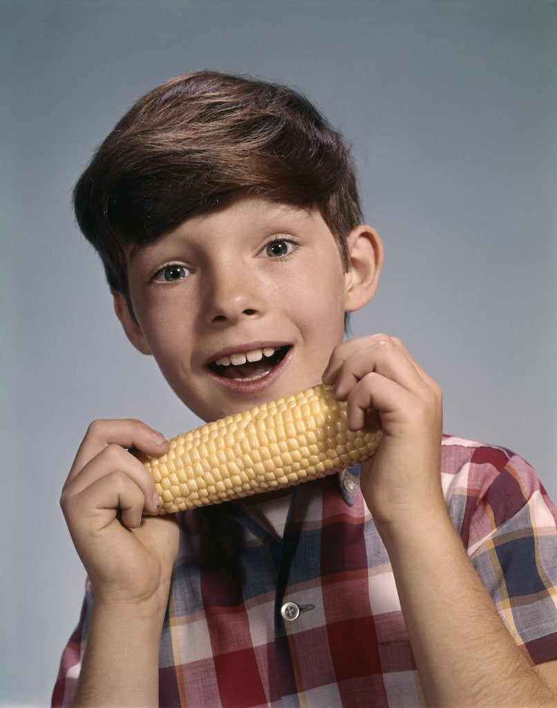 Detail of 1960s Boy Eating Corn On The Cob by Corbis