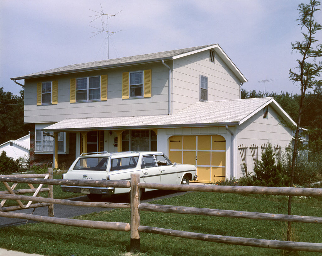 Detail of 1960s 1970s Suburban Home Two Story With Station Wagon In Driveway by Corbis