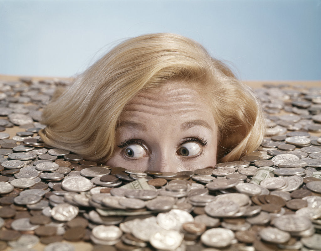 Detail of 1960s Startled Bug-Eyed Young Woman Buried Up To Her Nose In Pile Of Coins And Currency by Corbis