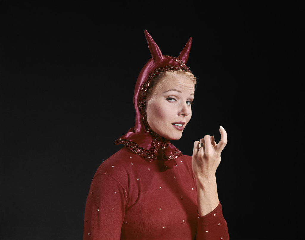 Detail of 1960s Woman Red Devil Costume With Horns Beckoning With Index Finger Come Hither Gesture by Corbis