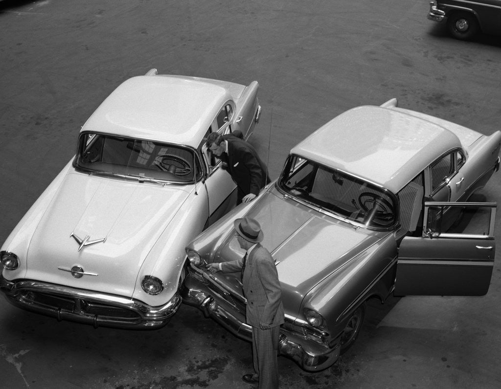 Detail of 1950s 1960s Automobile Fender Bender Accident In Parking Lot by Corbis