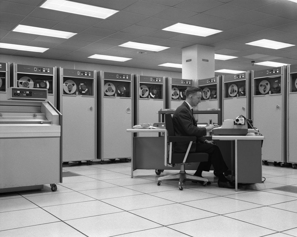 Detail of 1960s Man Programing Mainframe Computer At Control Room Console by Corbis