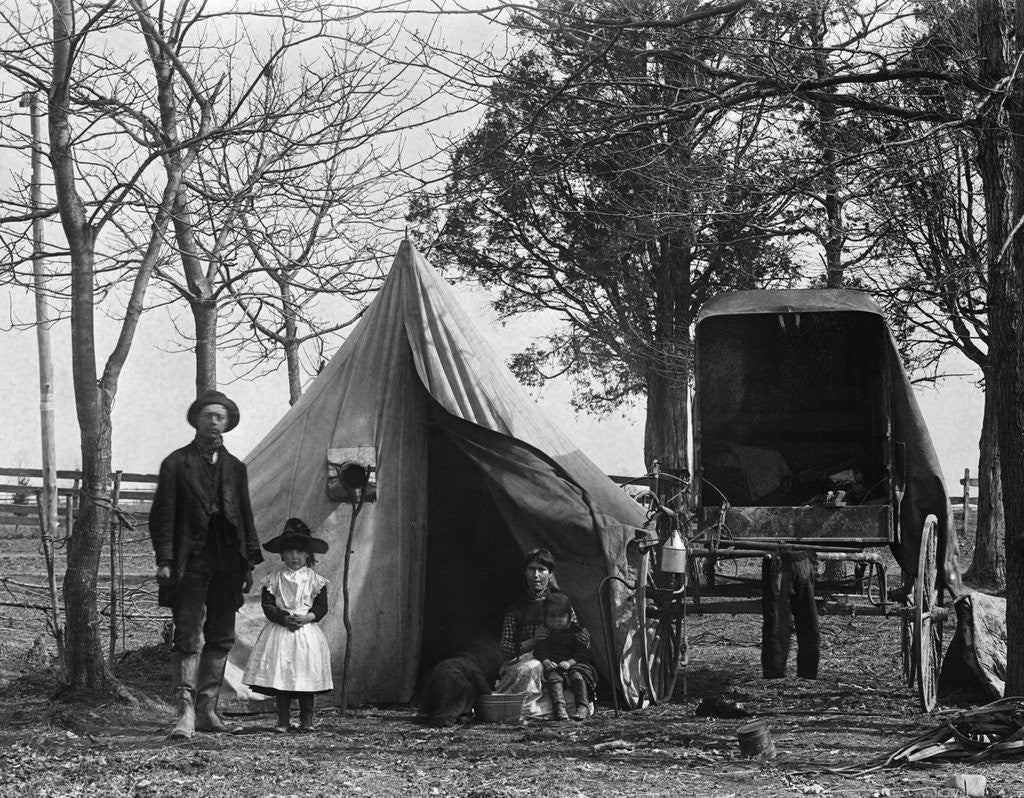 Detail of 19th Century Gypsy Camp Family Father Mother Daughter In Front Of Tent Next To Wagon by Corbis