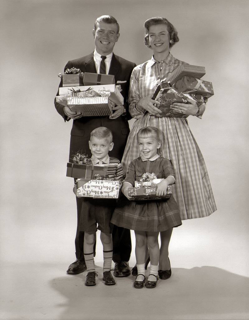 Detail of 1950s 1950s Family Carrying Christmas Gifts Wrapped Presents by Corbis