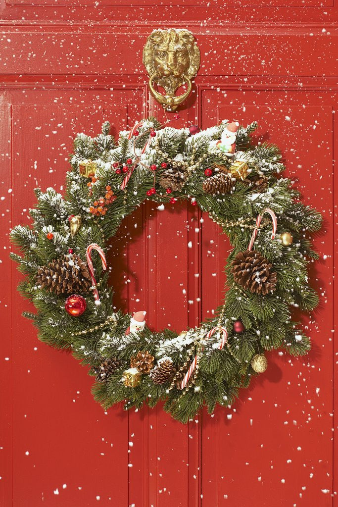 Detail of Christmas wreath hanging on a door by Corbis