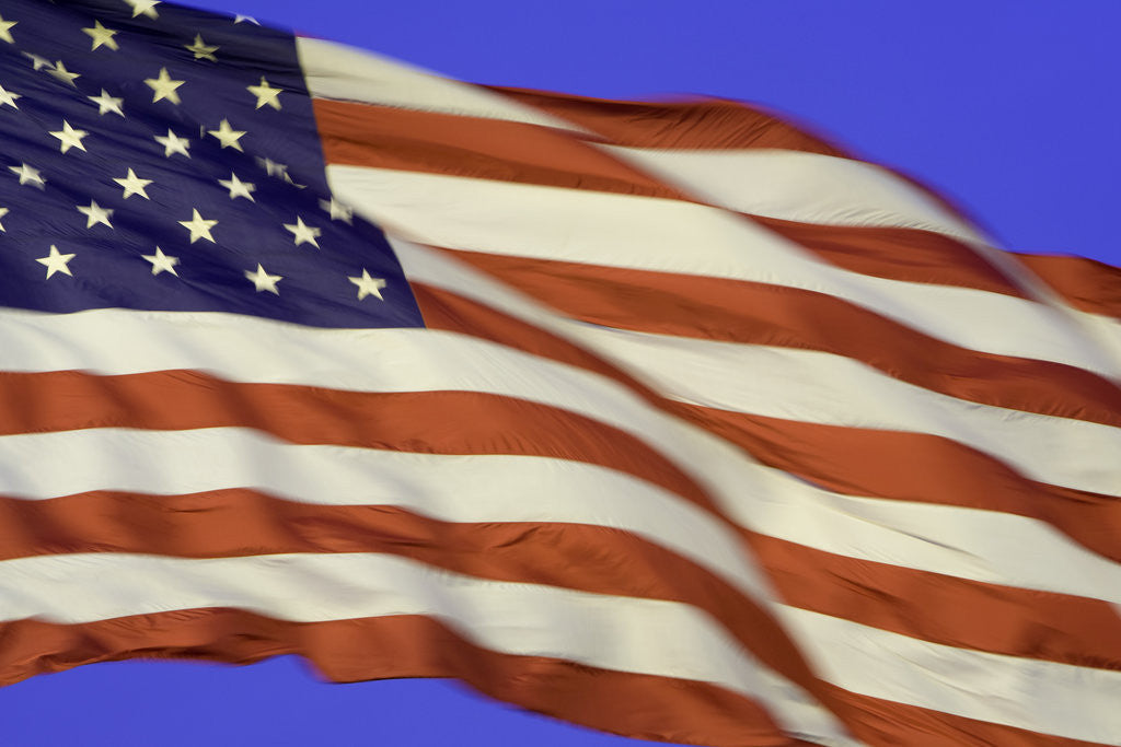 Detail of American flag unfurled by strong wind