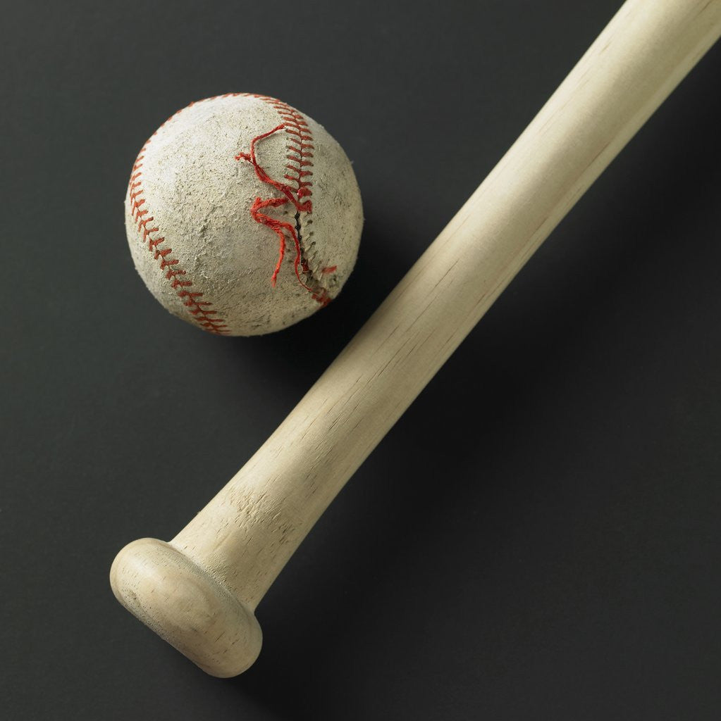 Detail of A bat and an old ball with its stich ripped by Corbis