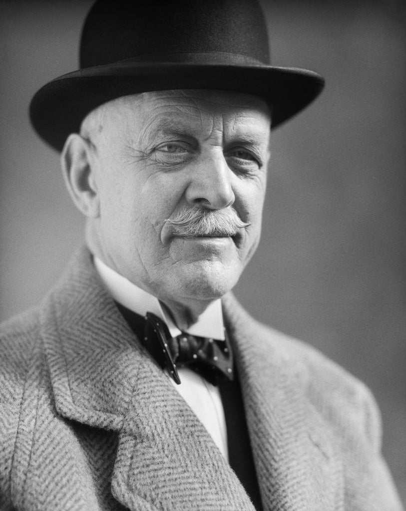 Detail of Portrait of older man with a mustache wearing a bowler hat and bow tie by Corbis