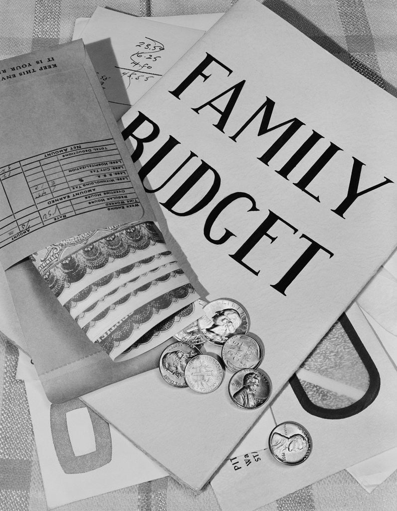 Detail of Still life family budget money currency cash coins bills payroll envelope by Corbis