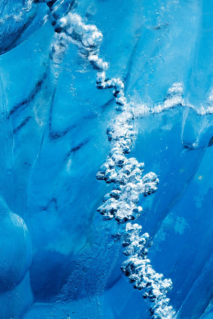 Detail of Air bubbles in melting iceberg by Corbis