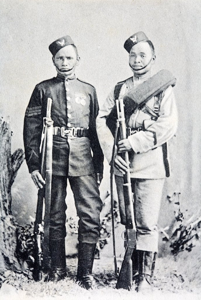 Detail of Postcard showing two Gurkha soldiers c 1900. They are shown with their service rifles and medals. The man on the left is a seargant. by Corbis