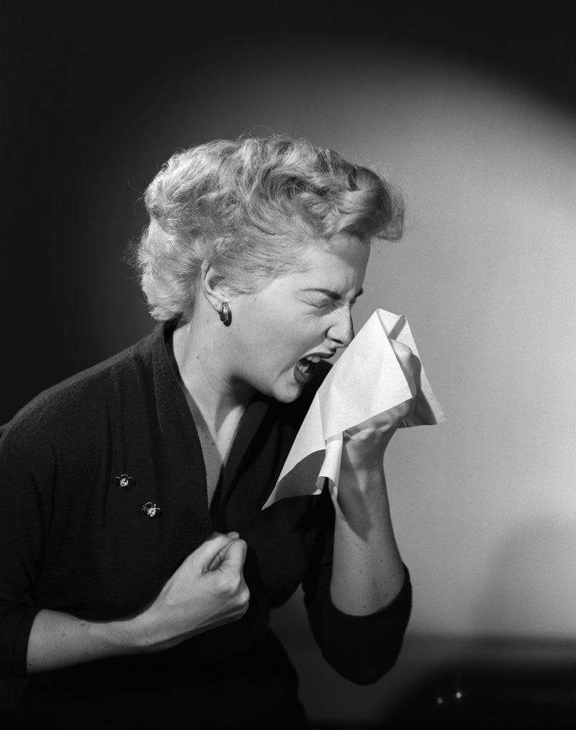 Detail of 1950s woman sneezing cold by Corbis