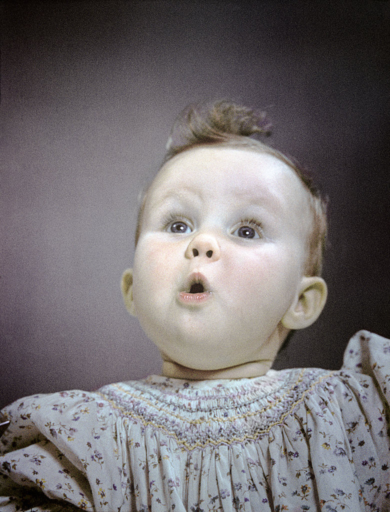 Detail of 1940s 1950s portrait baby cute facial expression of awe wonder surprise by Corbis