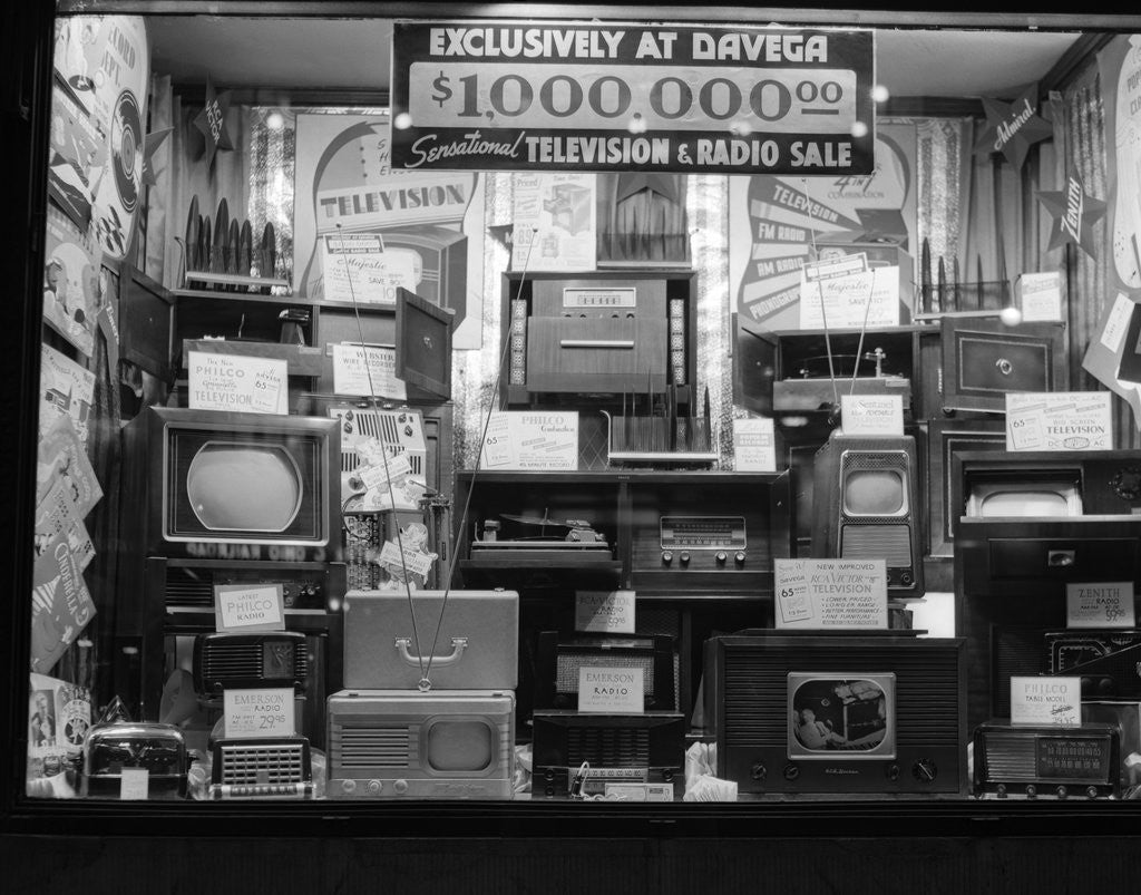 Detail of 1940s window of store selling radios and televisions advertising a million dollar sale by Corbis