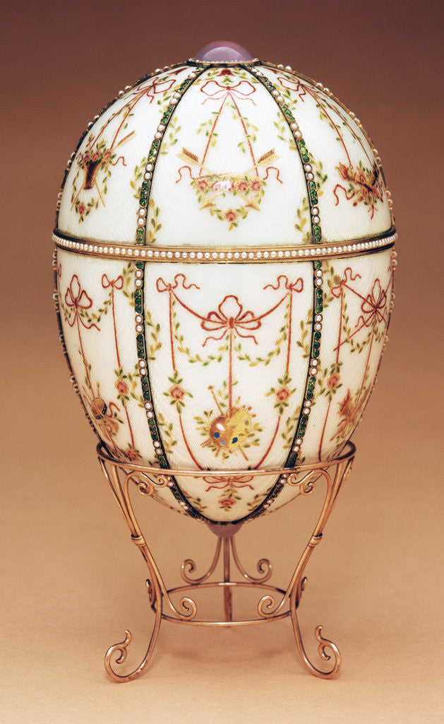 Detail of Faberge Kelch Bonbonniere egg shown in a gold egg-stand of scroll design by Corbis