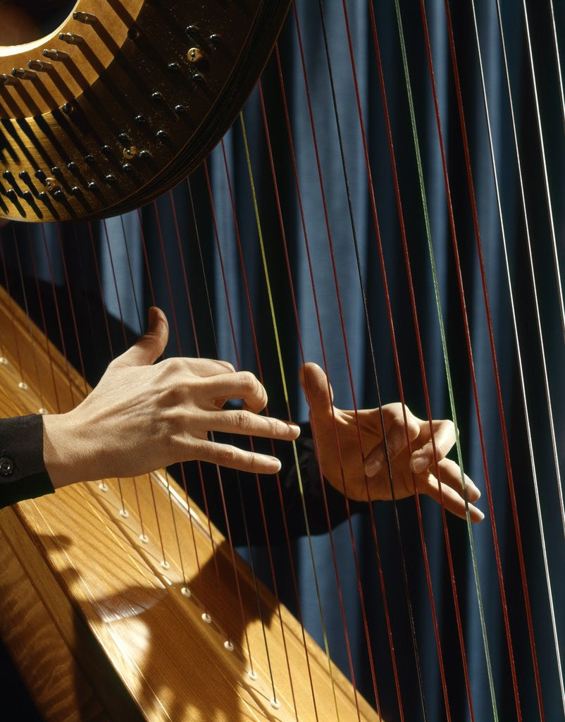 Detail of 1960 1960s Retro Close Up Of Womans Hands Playing Harp Plucking Strings by Corbis