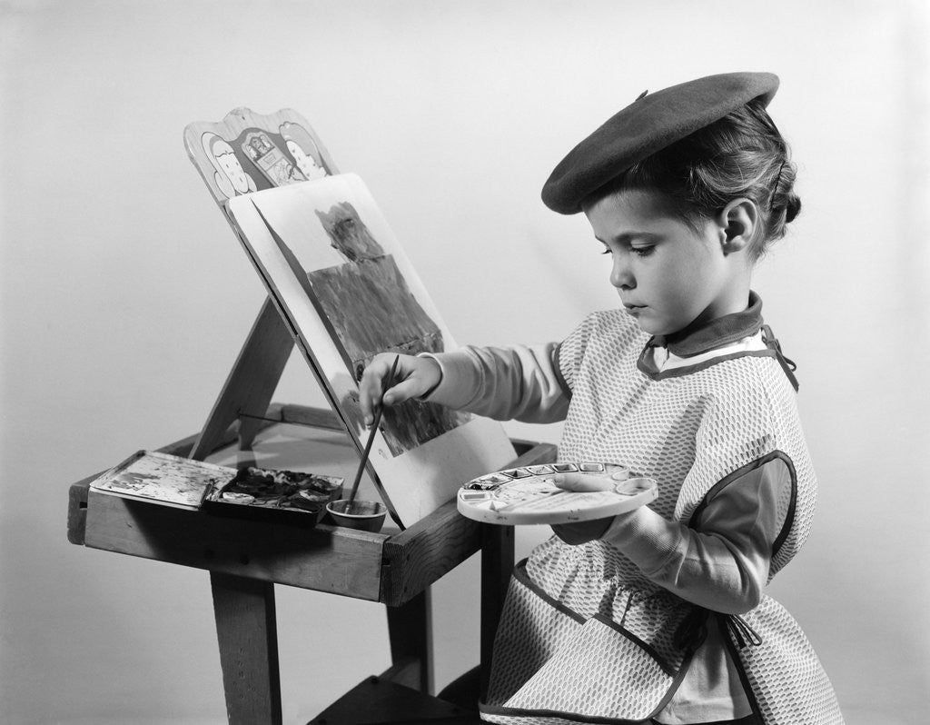 Detail of 1960s Little Girl Artist Sitting At Easel Painting by Corbis