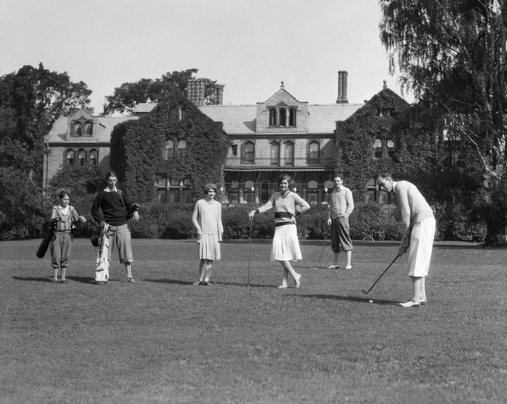 Detail of 1920s two women and four men playing golf by Corbis