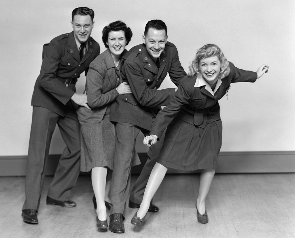 Detail of 1940s conga line with two soldiers and two women by Corbis