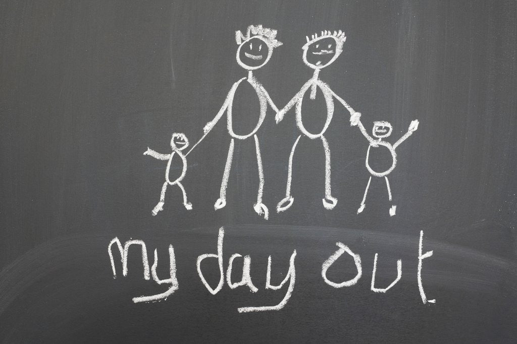 Detail of Blackboard with a child's drawing of a happy family day out by Corbis