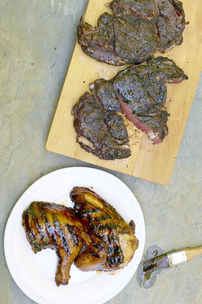 Detail of Barbecue chicken and steak by Corbis