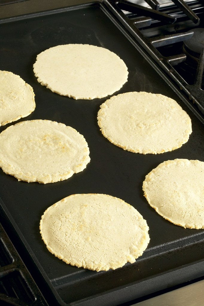 Detail of Cooking corn tortillas by Corbis