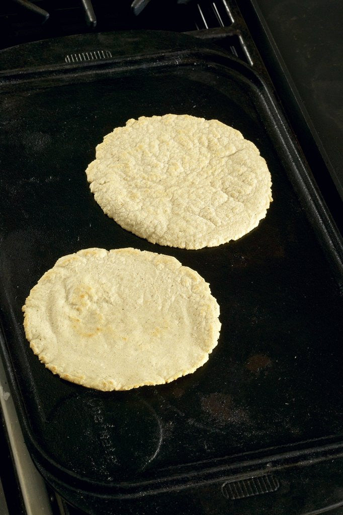 Detail of Cooking corn tortillas by Corbis