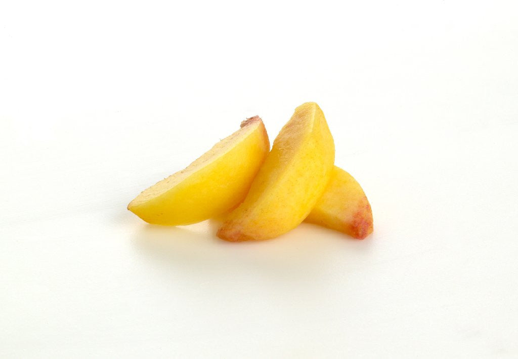 Detail of Sliced peach by Corbis